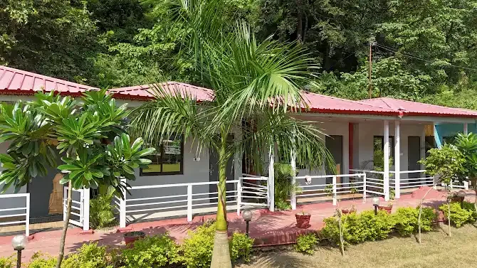 Guest cottages and palms beneath the hills