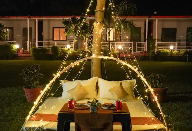 Evening seating under an arch of string lights