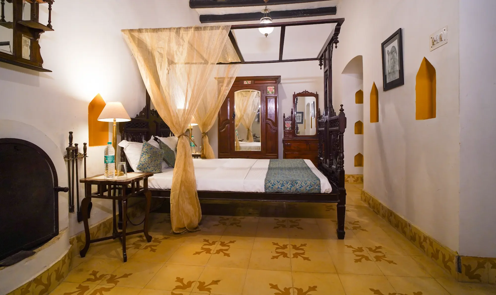 A guest room with a four-poster bed