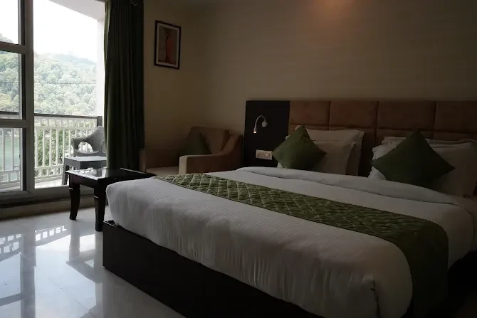 Guest bedroom with a view through the balcony doors