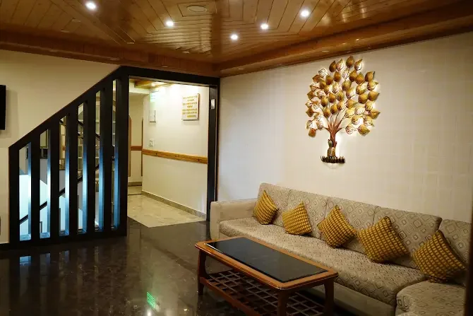 Lobby seating beneath a decorative golden tree