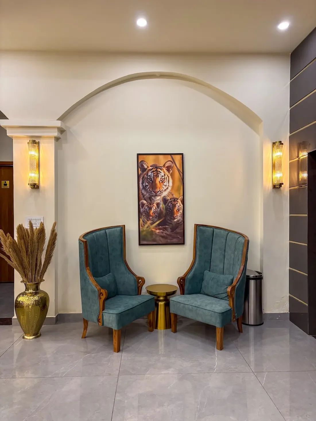 A pair of armchairs beneath a decorative arch