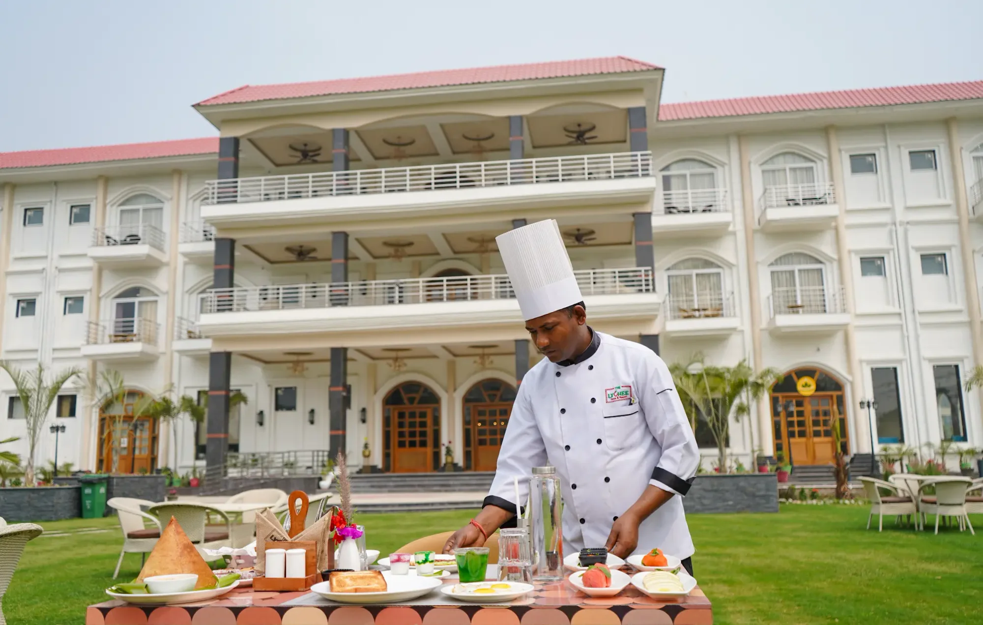 A chef preparing food on the lawn