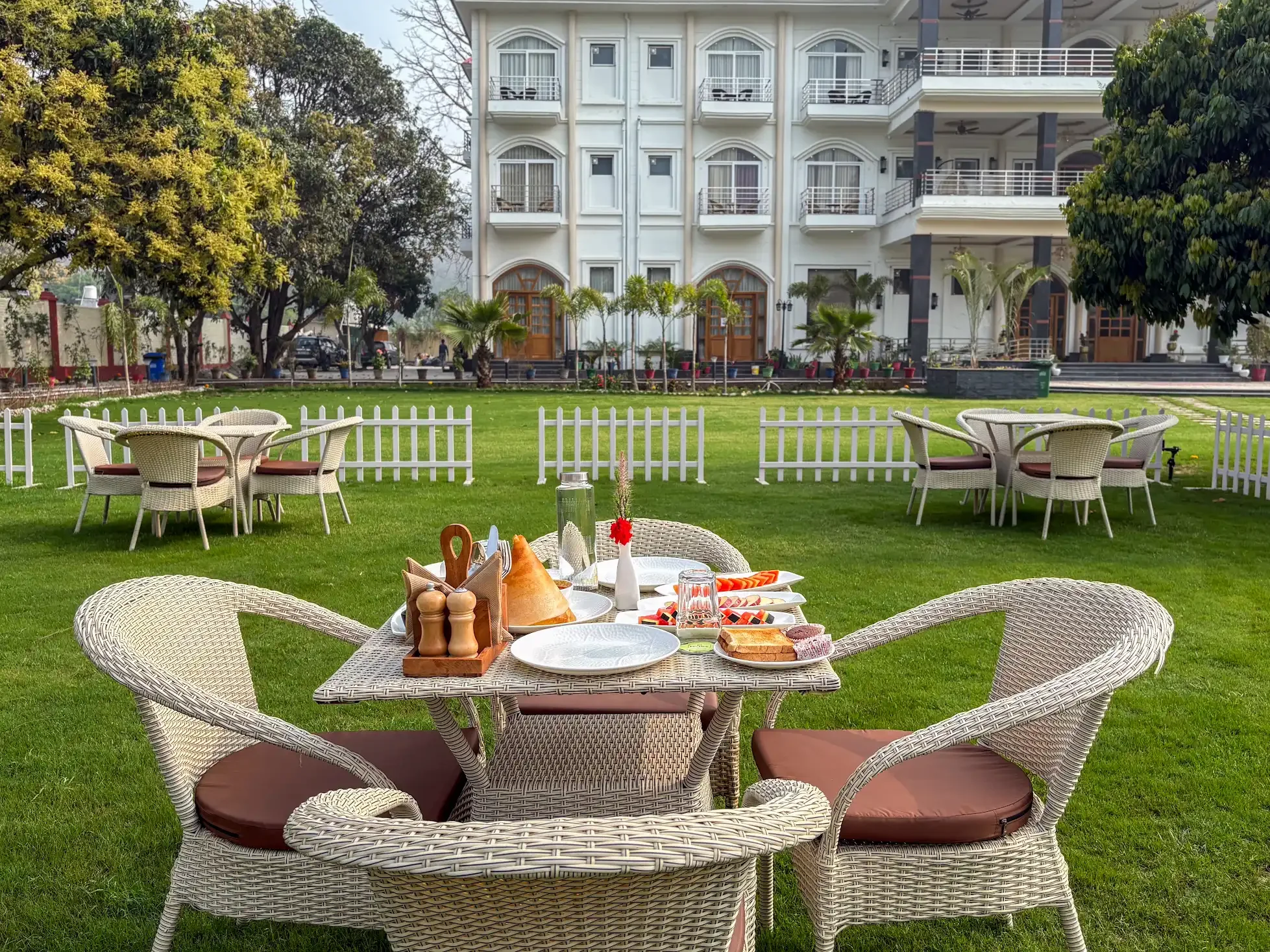 A breakfast table set in the garden