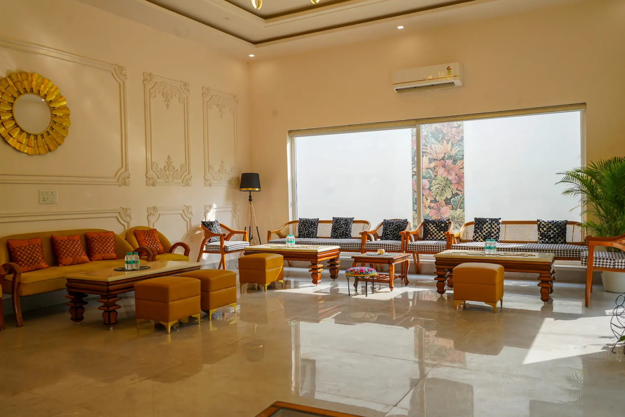 Lounge with upholstered seating and a large window