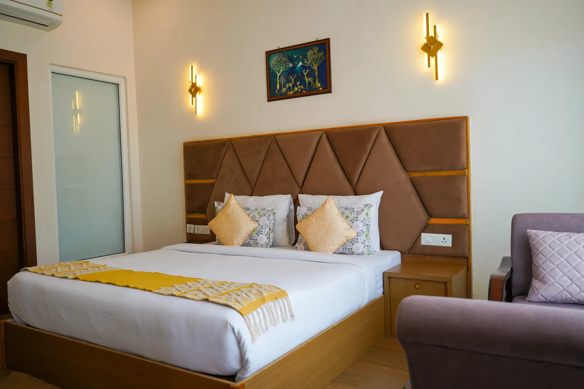 Guest bedroom with a geometric upholstered headboard