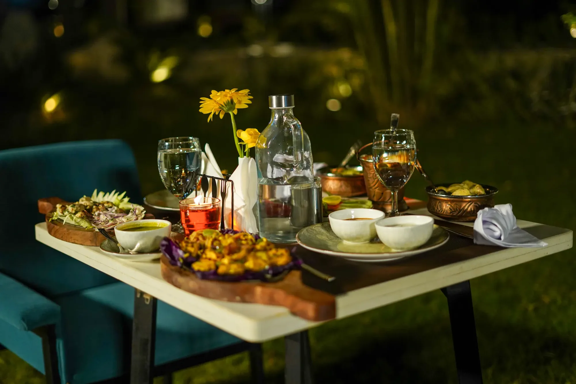 Dinner set among the garden greenery