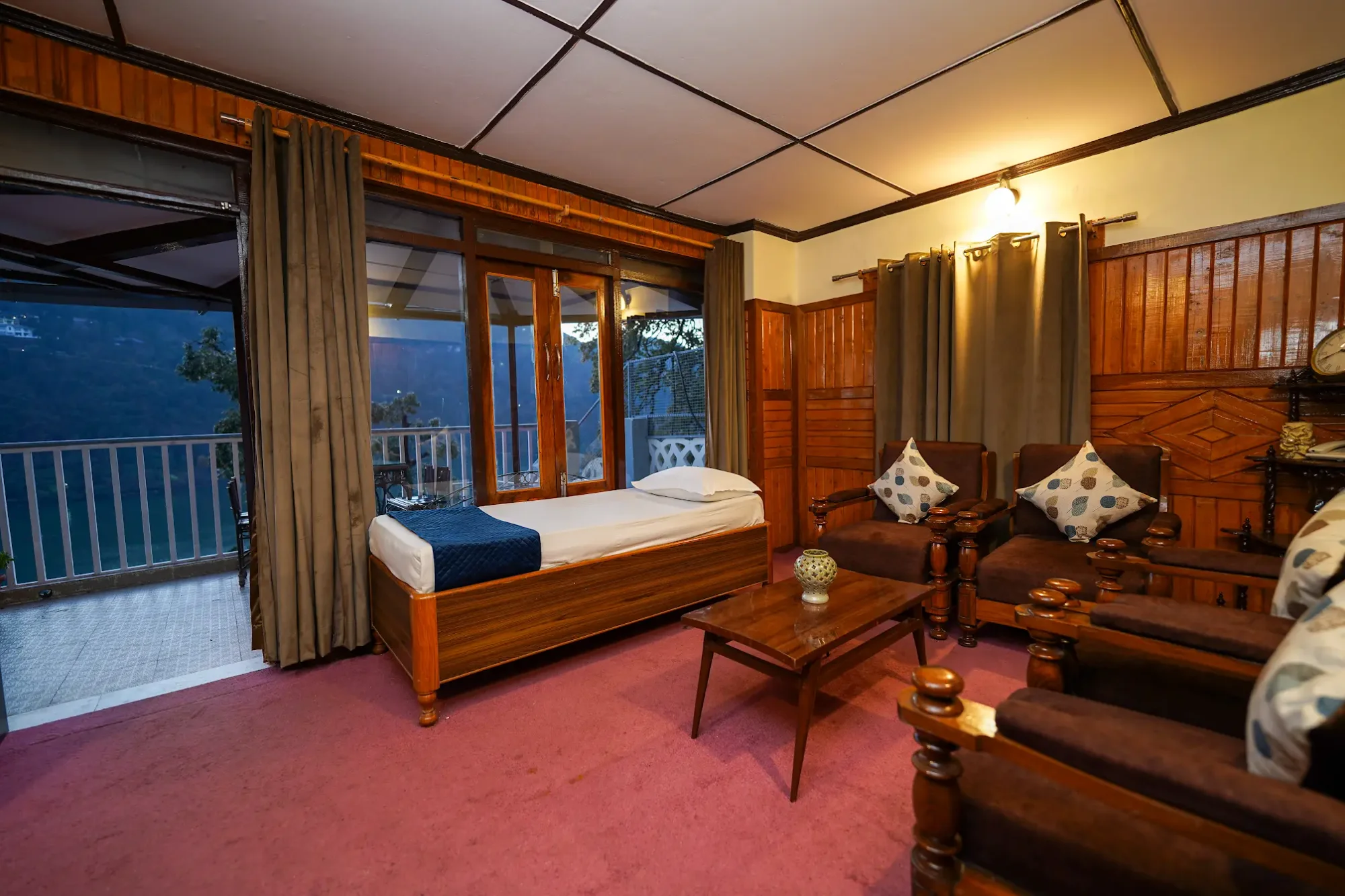 Wood-panelled room overlooking the lake